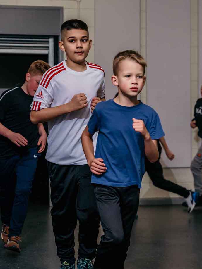 Boxing Academy pupils doing a running exercise Boxing Academy pupils doing a running exercise