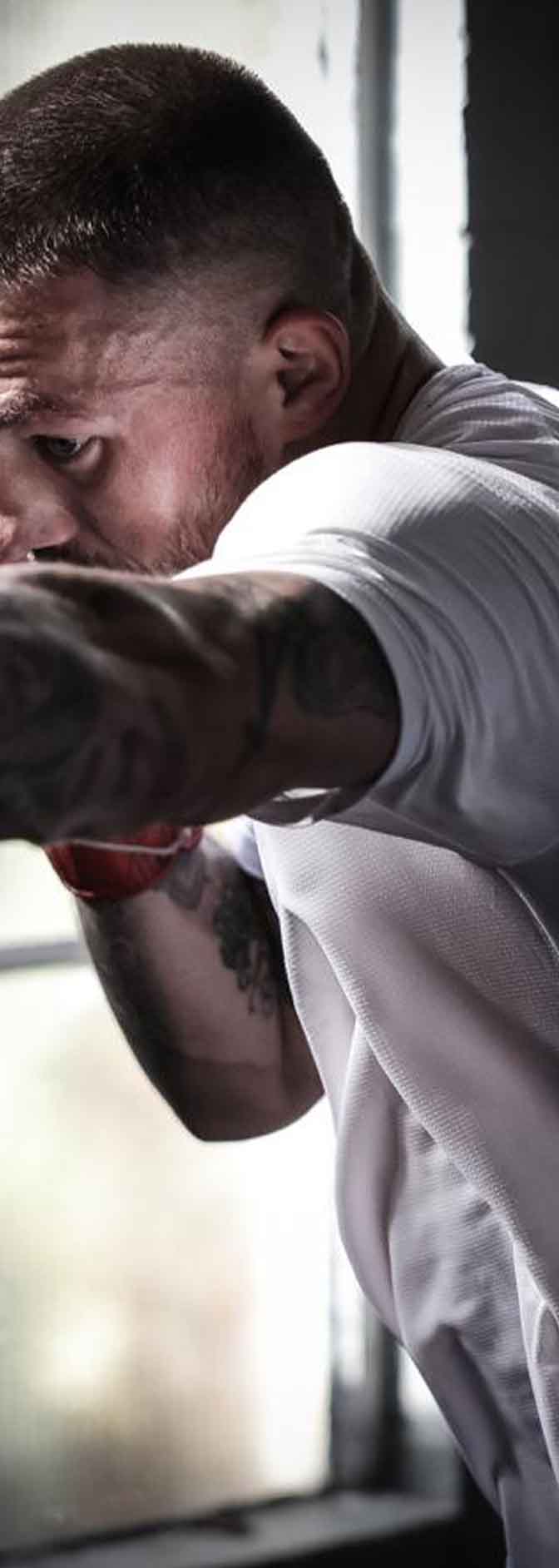 Jordan Reynolds throwing punches during boxing training