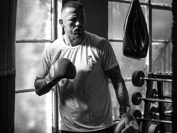Jordan Reynolds training with boxing bag