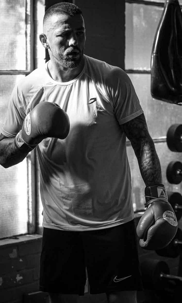 Jordan Reynolds training with boxing bag