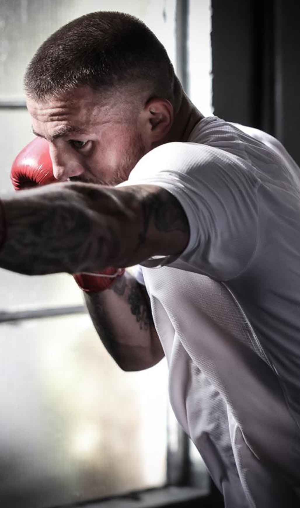 Jordan Reynolds throwing punches during boxing training