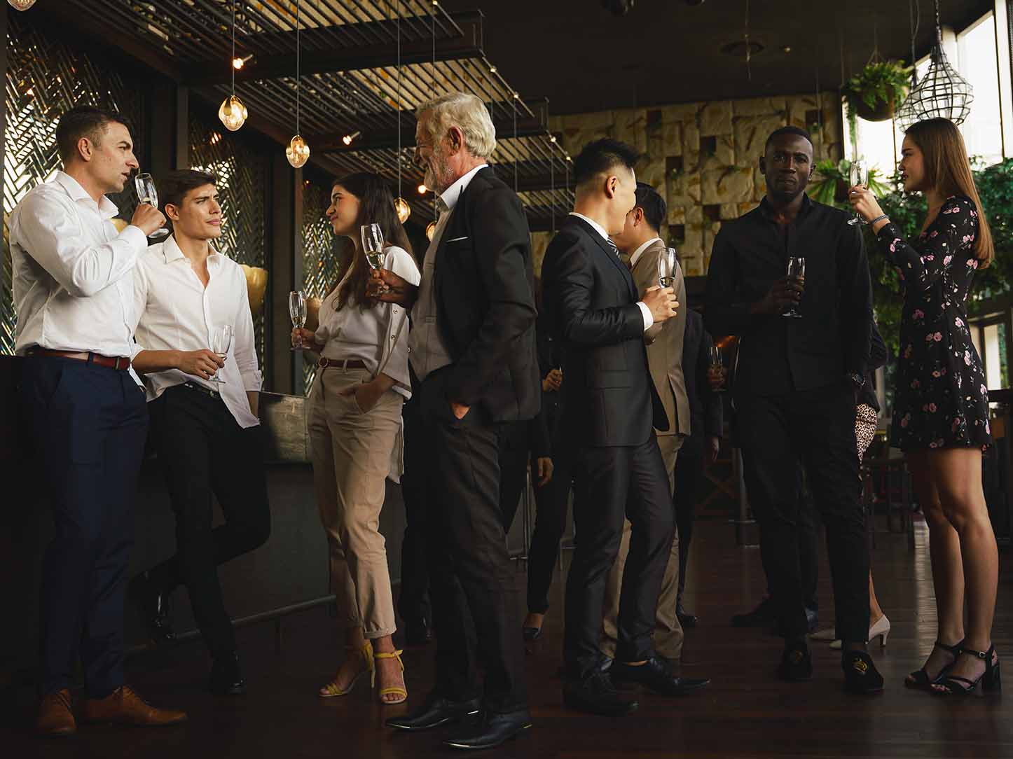 People dressed in suits having conversations