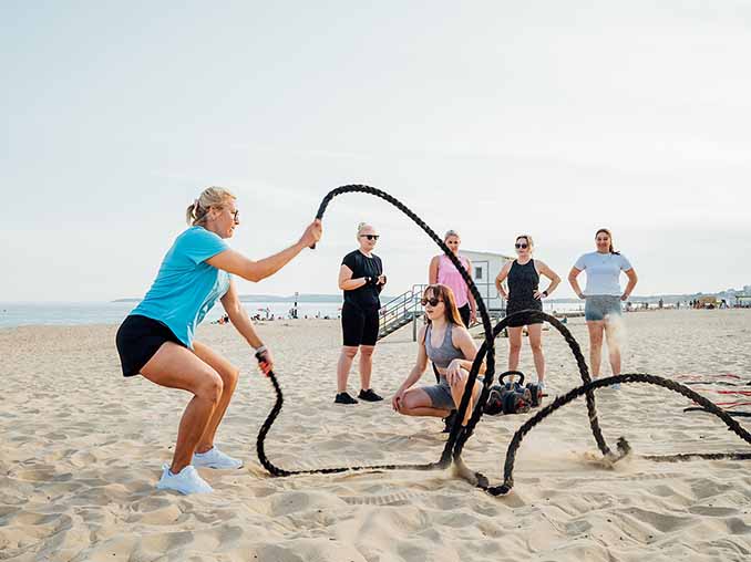 Fitness workouts with coach on the beach Fitness workouts with coach on the beach