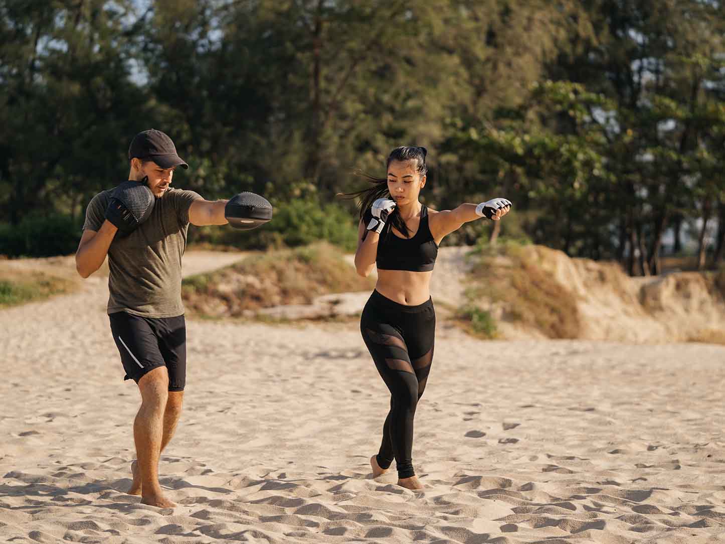 Woman boxing on a tropical beach Woman boxing on a tropical beach
